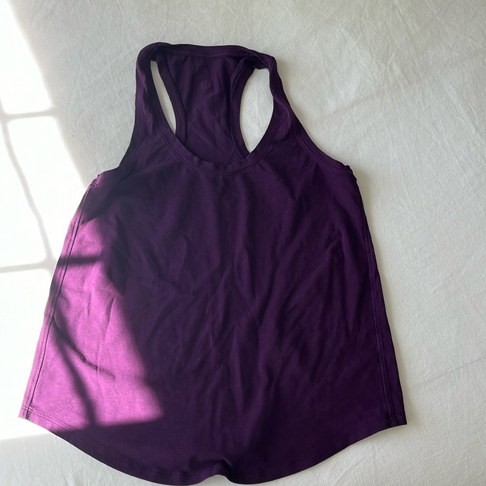 Size 4 lululemon purple tank. Only worn once but washed it